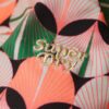 Górka bikini z trójkątnymi miseczkami i krzyżującymi się na plecach ramiączkami Górka bikini z trójkątnymi miseczkami i krzyżującymi się na plecach ramiączkami