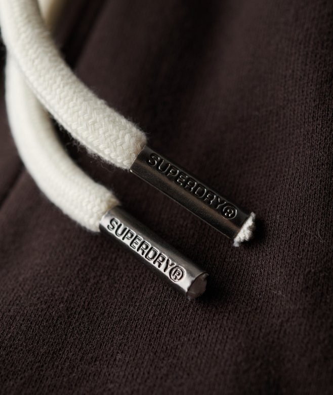 Spodnie dresowe z niskim stanem i rozszerzanymi nogawkami z neonowym logo w stylu Vintage Spodnie dresowe z niskim stanem i rozszerzanymi nogawkami z neonowym logo w stylu Vintage