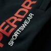 Sportowe spodnie dresowe z logo o zwężanych nogawkach Sportowe spodnie dresowe z logo o zwężanych nogawkach
