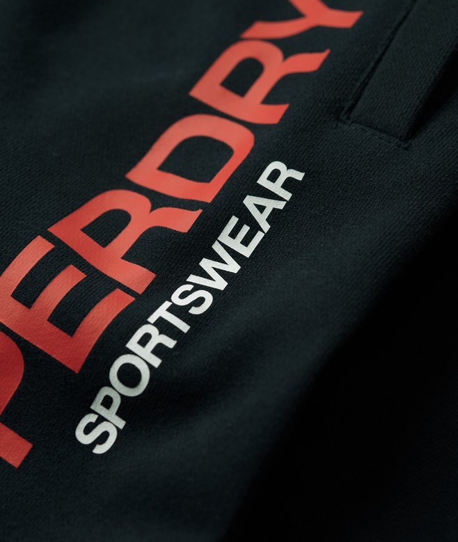 Sportowe spodnie dresowe z logo o zwężanych nogawkach Sportowe spodnie dresowe z logo o zwężanych nogawkach